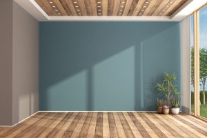 Empty blue living room with large window and hardwood floor - 3d rendering